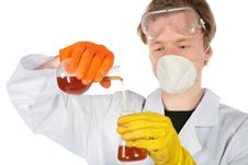 Scientist Pours Liquid From Flask In An Stock Images
