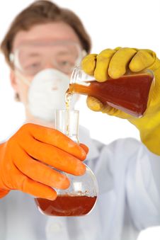 Scientist Pours Liquid From One Flask In Another Stock Image Scientist Pours Liquid From One Flask In Another Stock Image