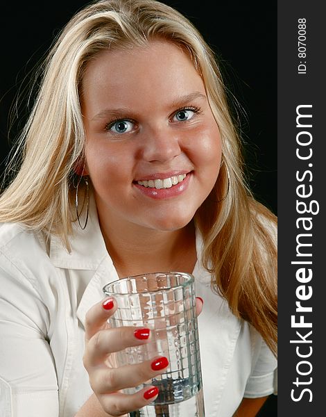 Blond girl drinking water from glass