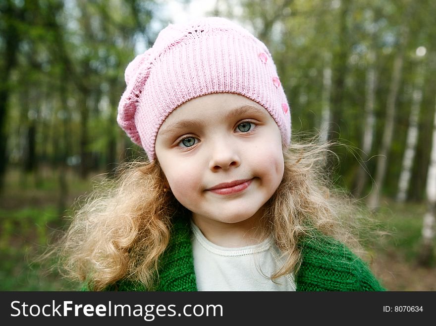 Portrait of the beautiful little girl with long hair in forest. Portrait of the beautiful little girl with long hair in forest