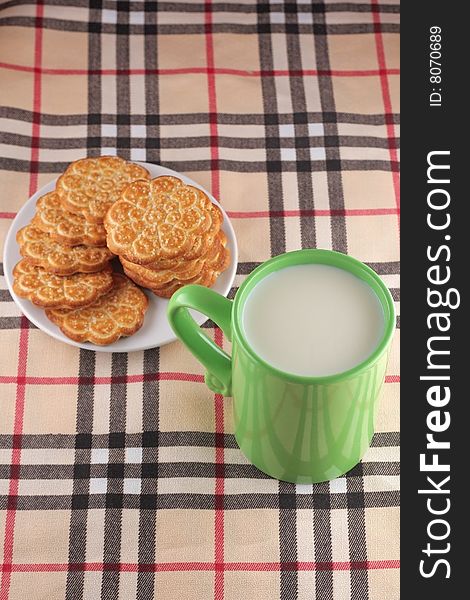 Cookie and cup with milk
