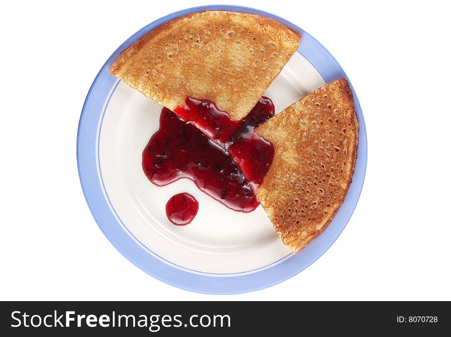 Pancakes with red jam on dish