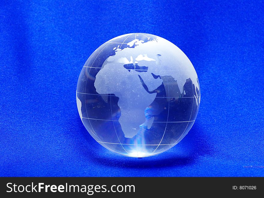 Perfect planet  crystal ball globe isolated on blue. Perfect planet  crystal ball globe isolated on blue