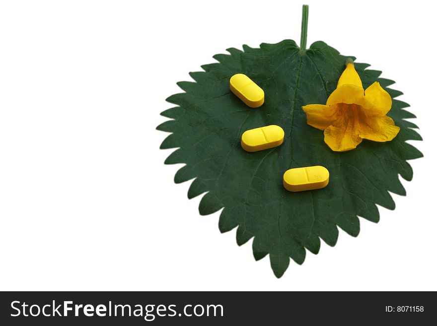 Yellow tablets and flower