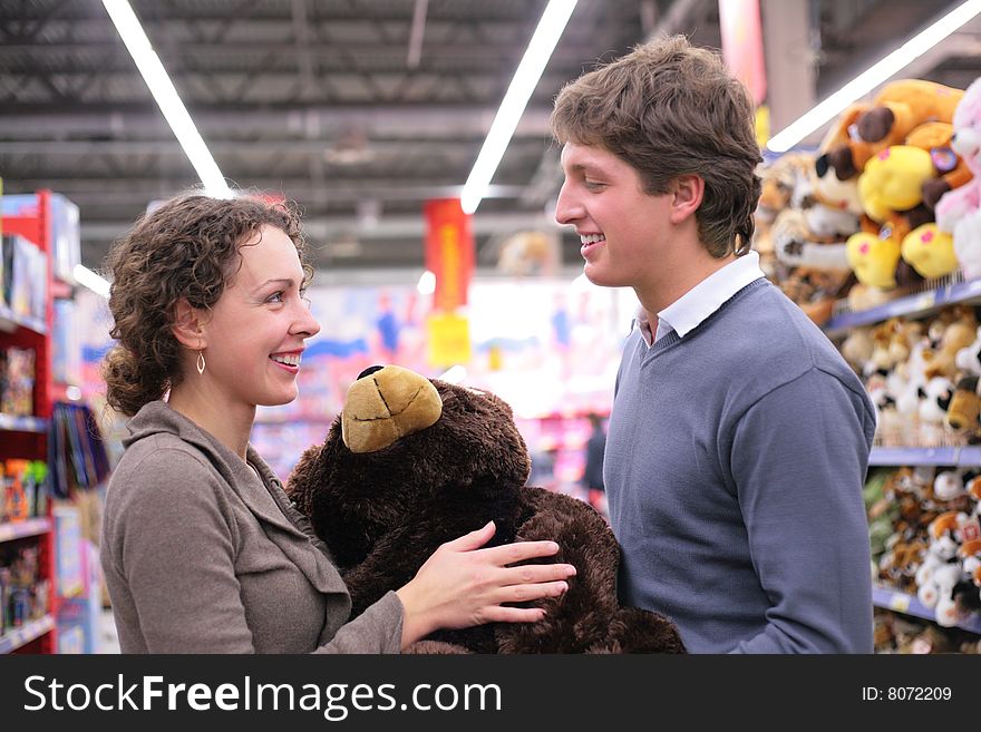 Couple in shop with soft toy