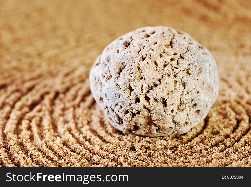 Sea sand and stone in the summer morning on a beach. Sea sand and stone in the summer morning on a beach