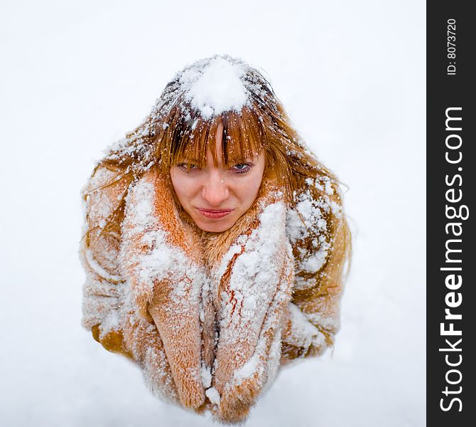 Upset red-heared girl in fur coat - shallow DOF. Upset red-heared girl in fur coat - shallow DOF