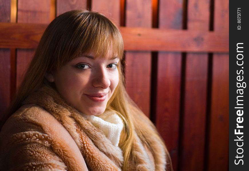 Happy red-haired girl in fur coat - shallow DOF. Happy red-haired girl in fur coat - shallow DOF