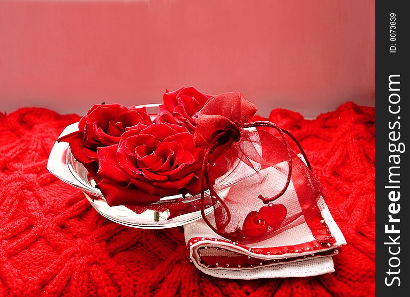 Scarlet roses and two hearts