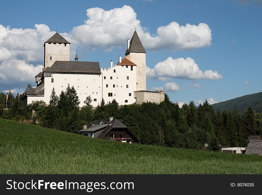 View of the medieval Mauterndorf castle from meadows around Mauterndorf town near Salzburg, Austria. View of the medieval Mauterndorf castle from meadows around Mauterndorf town near Salzburg, Austria