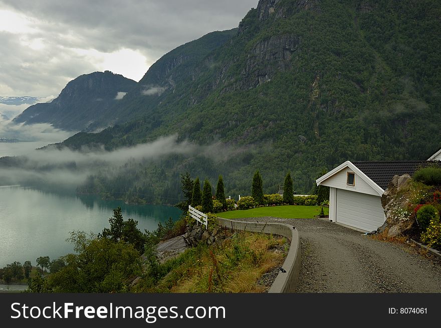 The house on the bank of a fjord. The house on the bank of a fjord