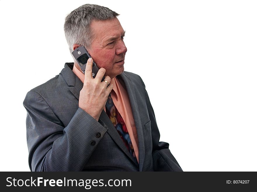 Portrait of a senior businessman, 3/4 view, listening to  cell phone, isolated on a white background. Portrait of a senior businessman, 3/4 view, listening to  cell phone, isolated on a white background.