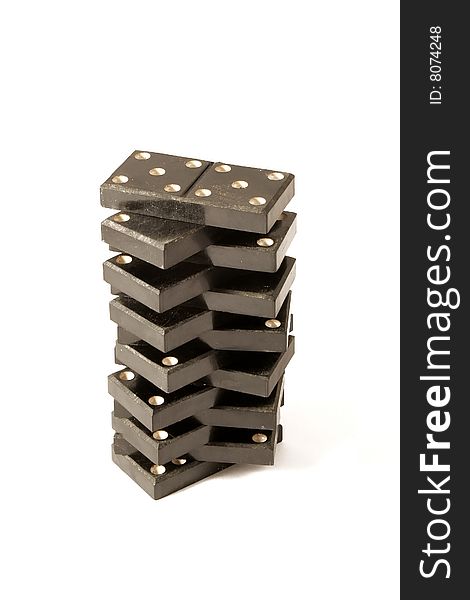 Tower from dominoes on a white background