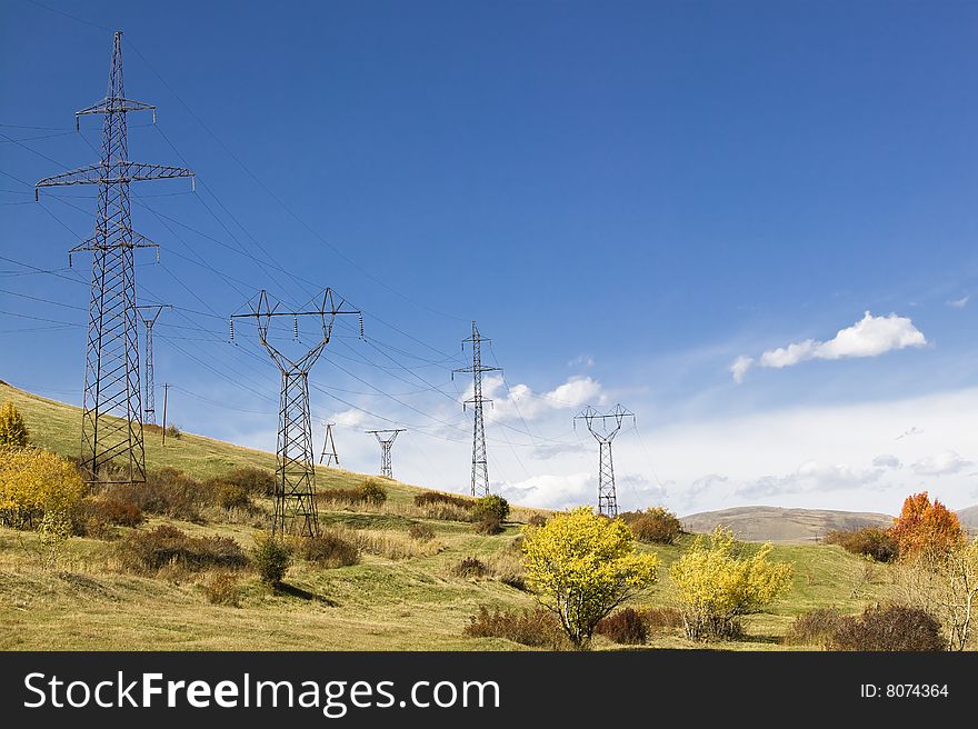 Power lines in an autumn time landscape. Power lines in an autumn time landscape