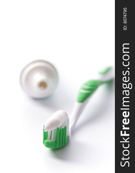 Toothpaste and toothbrush on white. dental care