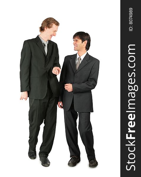 Two friendly businessmen walking on white background