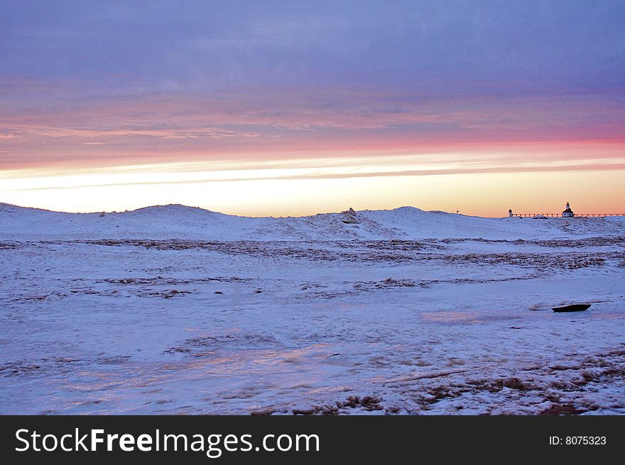 Lighthouse during a Winter Sunset. Lighthouse during a Winter Sunset