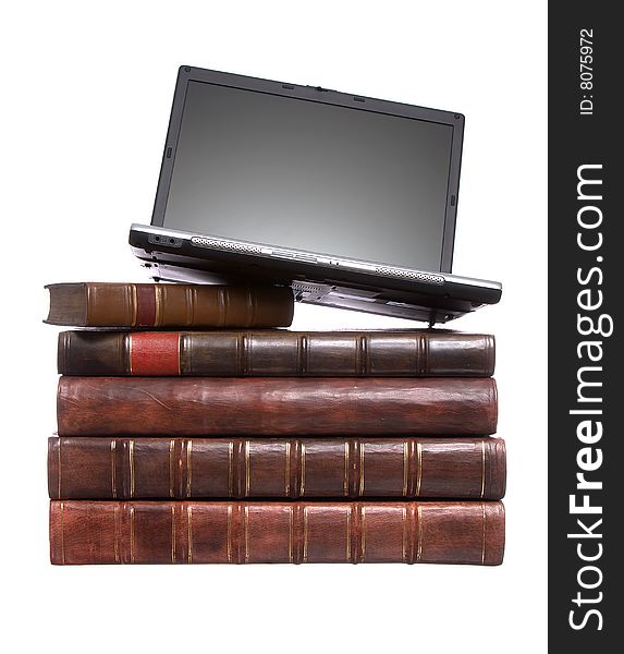 Old leather bound books with a laptop isolated on a white background