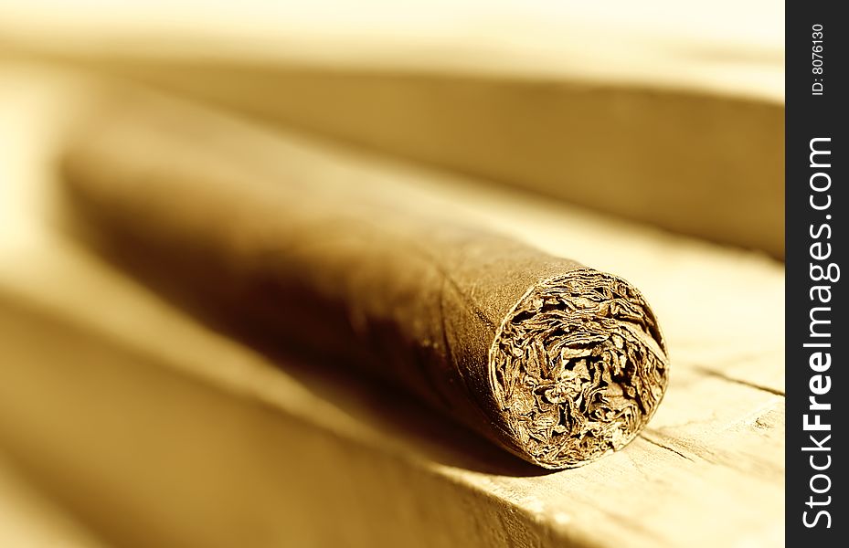Cigar on wooden  background (shallow DOF)