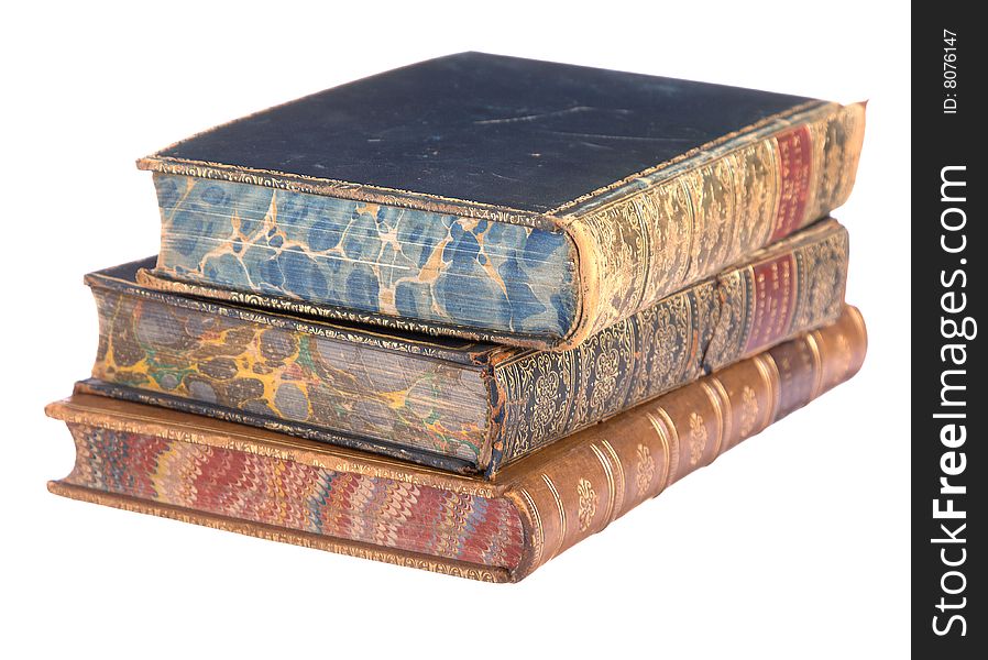 A pile of old leather bound books isolated on a white background