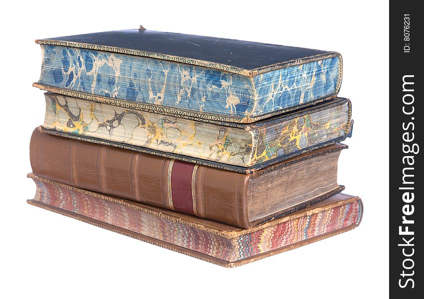 A pile of old leather bound books isolated on a white background