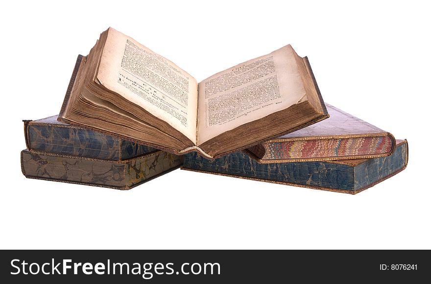 A pile of old leather bound books isolated on a white background
