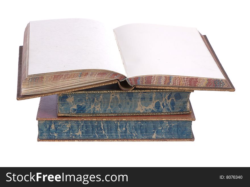 A pile of old leather bound books isolated on a white background