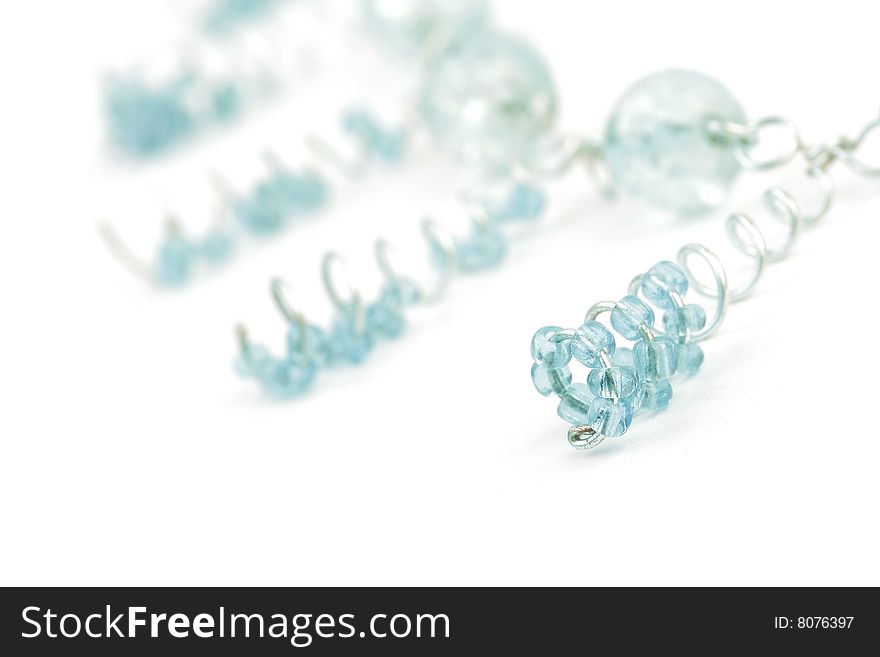 Close up of Detail - blue Beads on Necklace. With white background. Soft focus view.