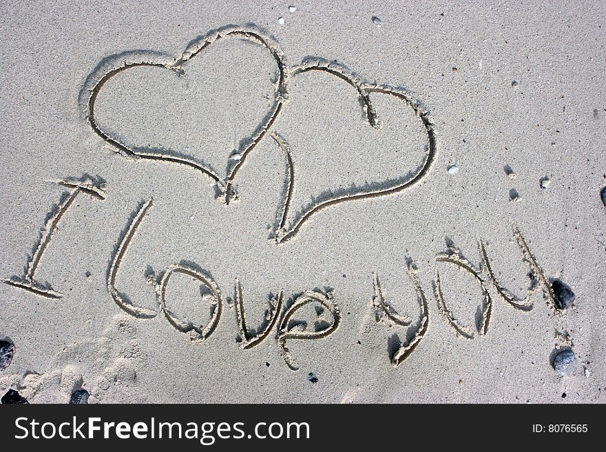 I love you scribed on the sandy beach