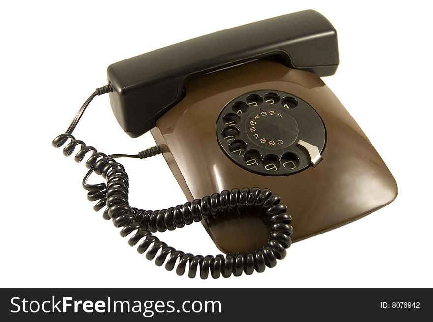 Old telephone on white background