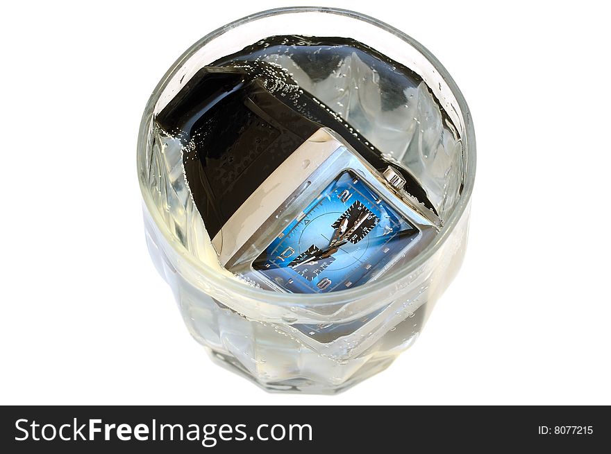 Waterproof watch in glass with water.