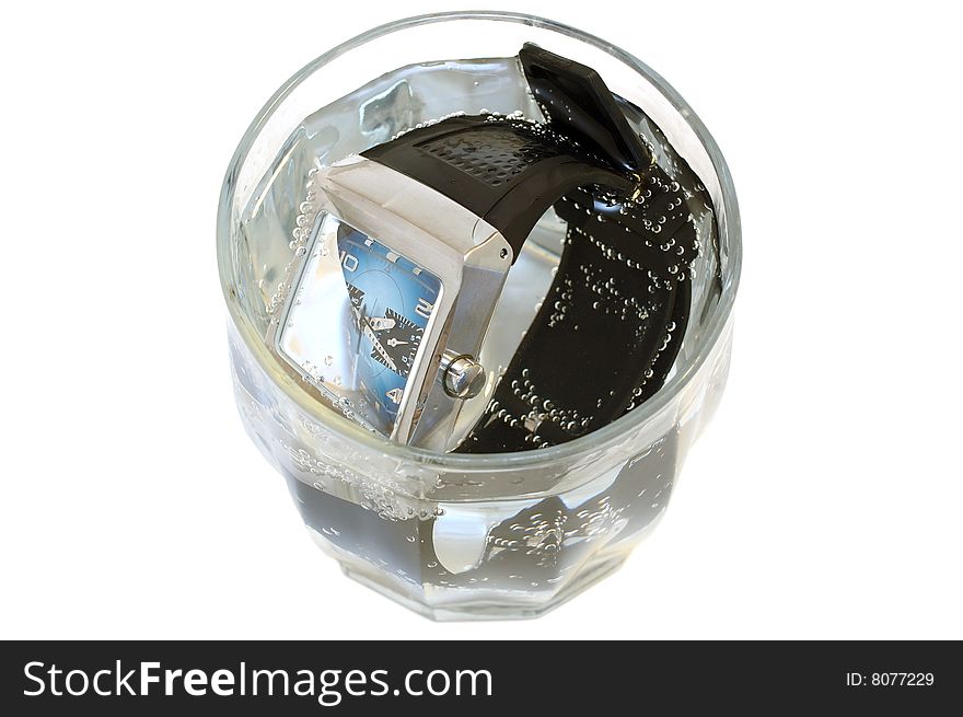 Waterproof watch in glass with water.