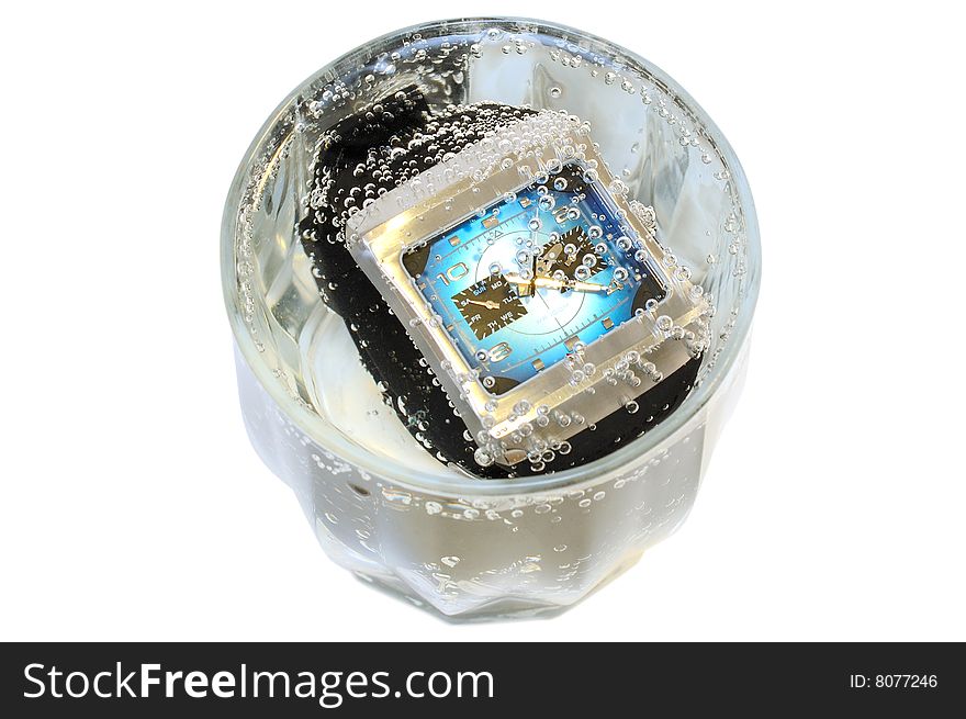 Waterproof watch in glass with water.