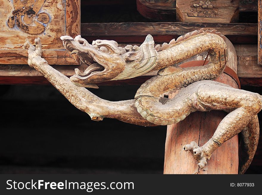 Art wooden carvings of dragon on the Temple's Gate,Jinci Temple in Taiyuan,Shannxi,China. Art wooden carvings of dragon on the Temple's Gate,Jinci Temple in Taiyuan,Shannxi,China