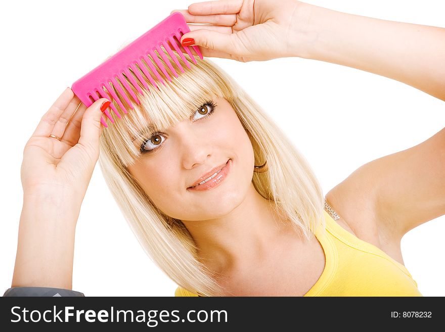 Blonde girl combs her hair. Blonde girl combs her hair