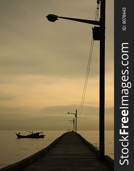 A jetty equipped with a row of lamp post to assist the fishermen at night. A jetty equipped with a row of lamp post to assist the fishermen at night.