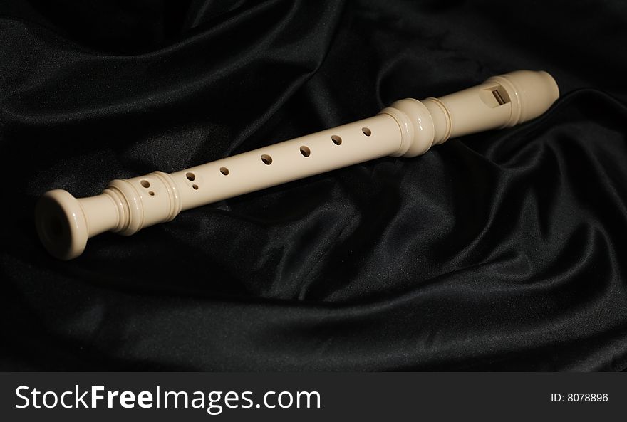 Recorder Flute on black background