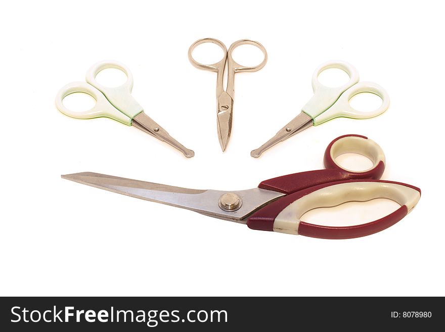 Different scissors under the white background