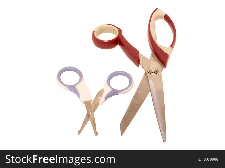 Pair of scissors under the white background