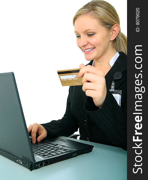 Business woman holding credit card in front of computer. concept for online shopping. Business woman holding credit card in front of computer. concept for online shopping