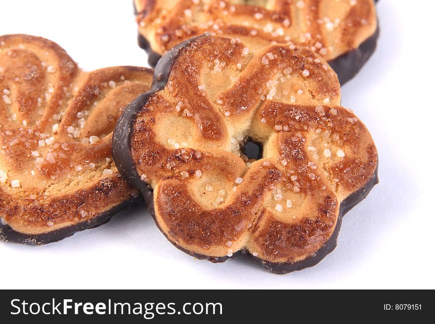 Sweet cookies with sugar and chocolate on a white background.