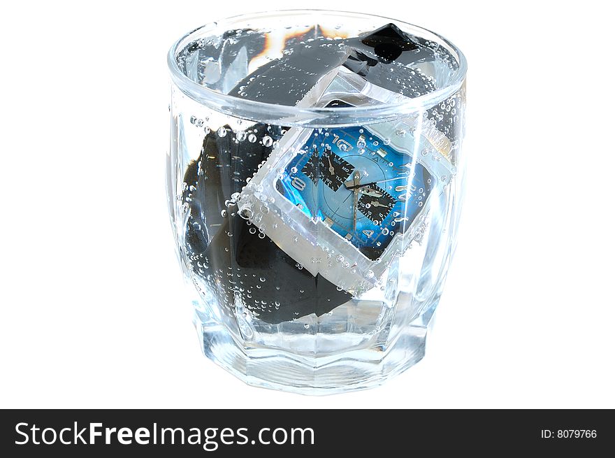 Waterproof watch in glass with water.