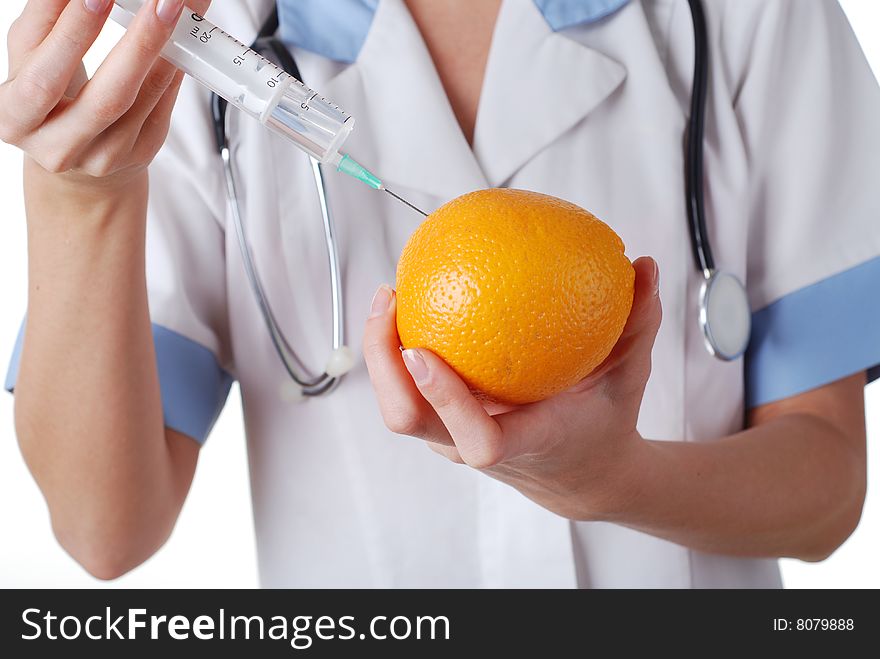 Nurse with syringe make injection in orange