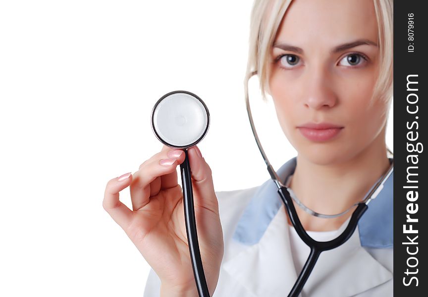 Beautiful nurse with stethoscope on white background