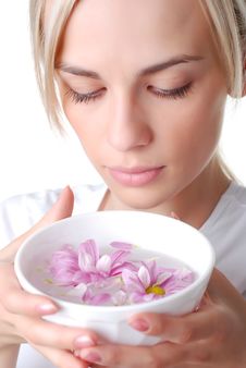 Woman And Bowl Of Flowers Stock Photo