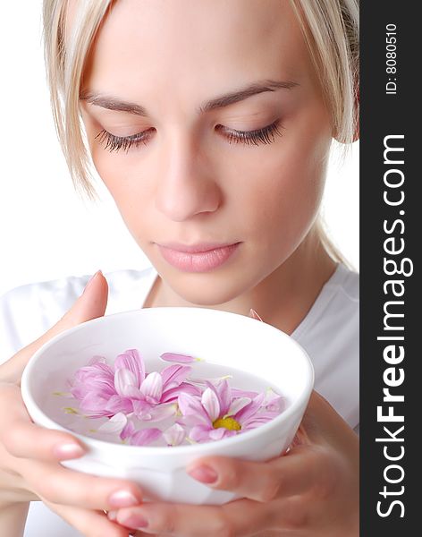 Beautiful blond woman with bowl of flowers. Beautiful blond woman with bowl of flowers