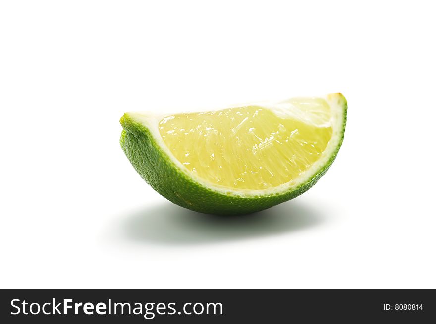 A piece of lime isolated on a white background.