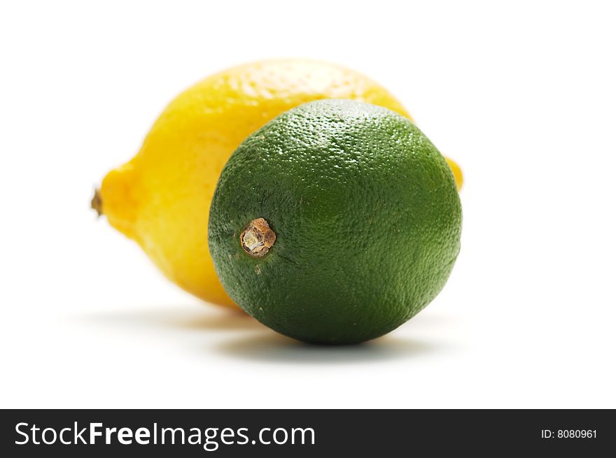 Yellow lemon and green lime isolated on a white background. Yellow lemon and green lime isolated on a white background.