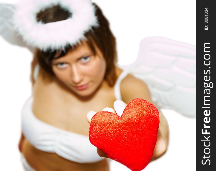 Young woman in angel's costume with red heart