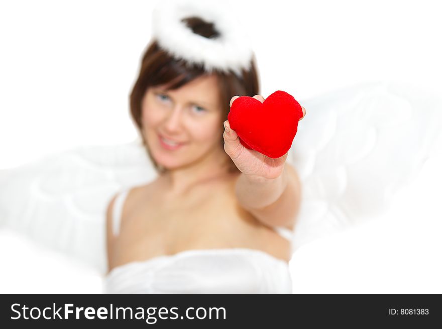 Young woman in angel's costume with red heart, isolated on white